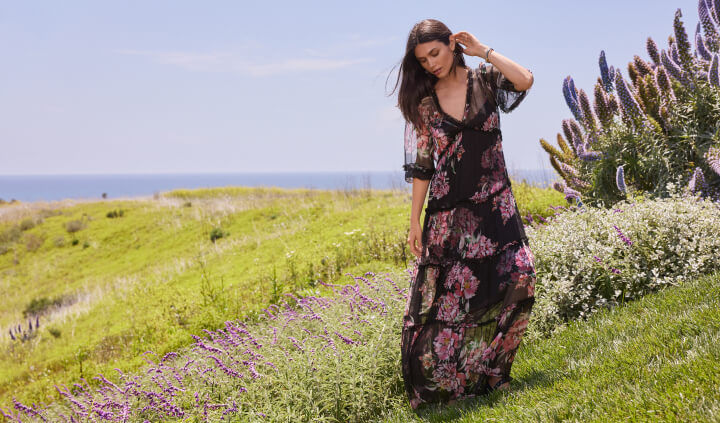 Model wearing floral maxi dress in the field