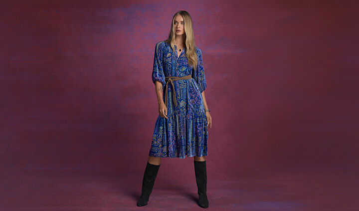 Model wearing blue velvet burnout midi dress