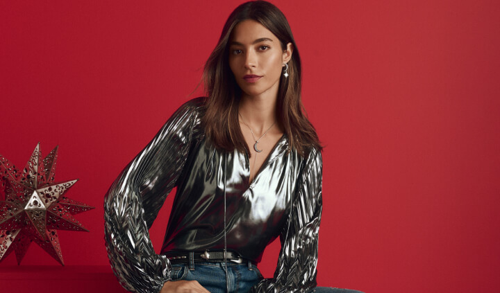 Model in silver pleated blouse